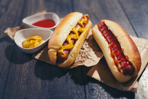 Hotdogs with ketchup and mustard Hotdogs with ketchup and mustard